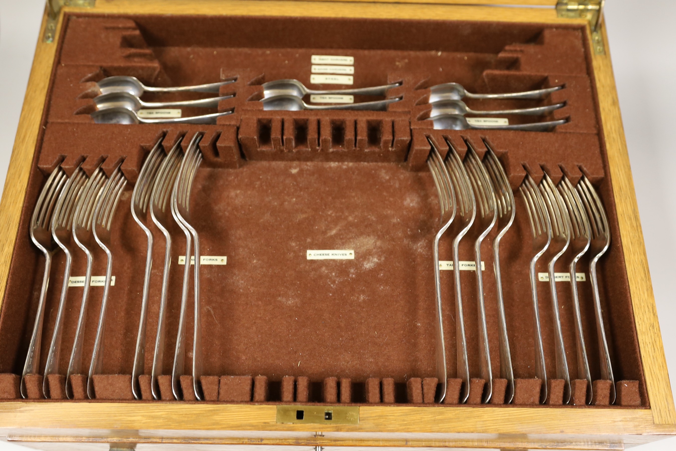 A matched part canteen of George V silver Hanovarian pattern flatware, comprising fifty four items, mostly Josiah Williams & Co, London, 1935